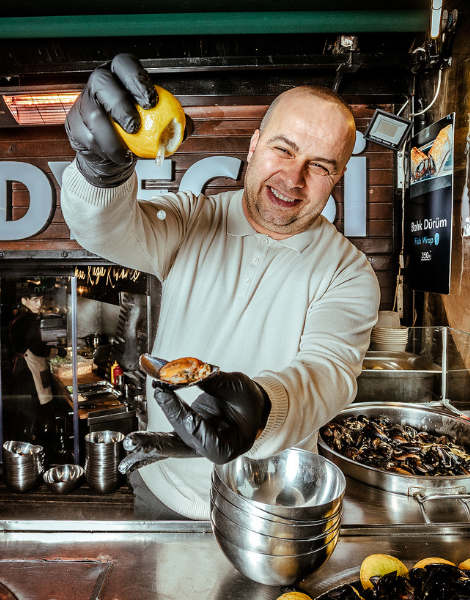 Squeeze of lemon over stuffed mussels
