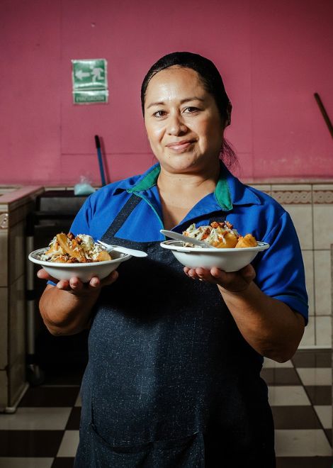 Serving a traditional San Salvador lunch. 