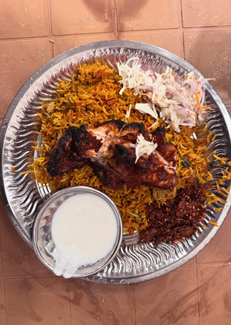Fragrant chicken biryani with golden, cheese-filled parathas.