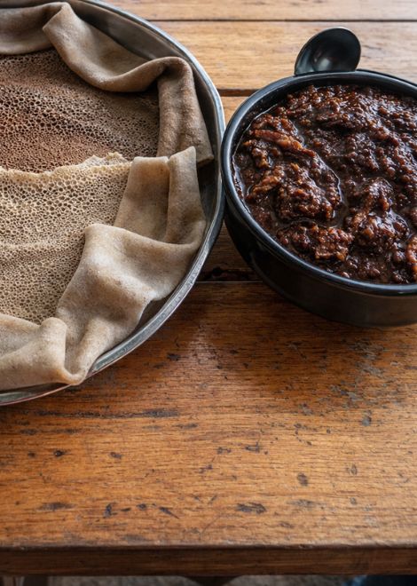 Duba quanta, dried squash stew with tangy injera