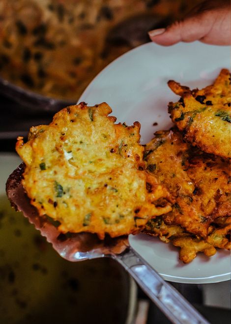 Traditional Peruvian torrejas, crisp vegetable fritters fried until golden.