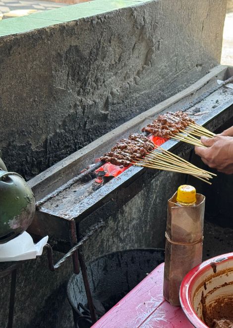 Smoky, charred sate cooked fresh over glowing coals.