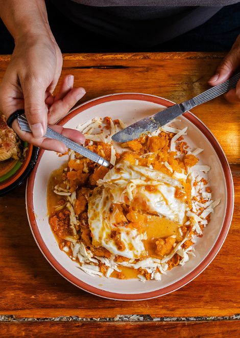 Creamy tigrillo loaded with plantain, eggs and melted cheese.