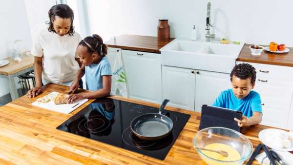 Mother cooking with son and daughter