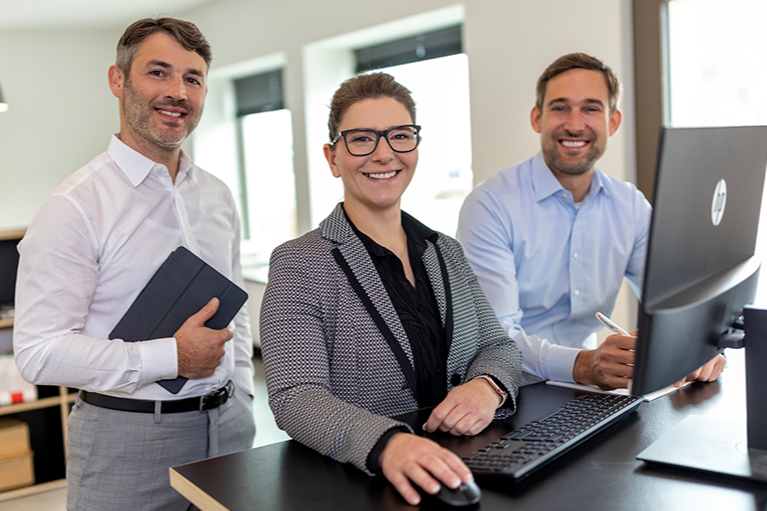 Employees at computer