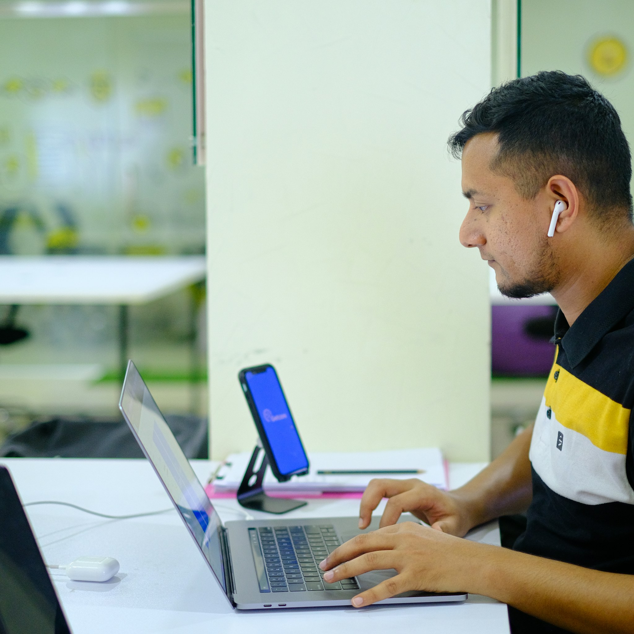 Professional using a laptop with a collaboration platform open, showing seamless integration.