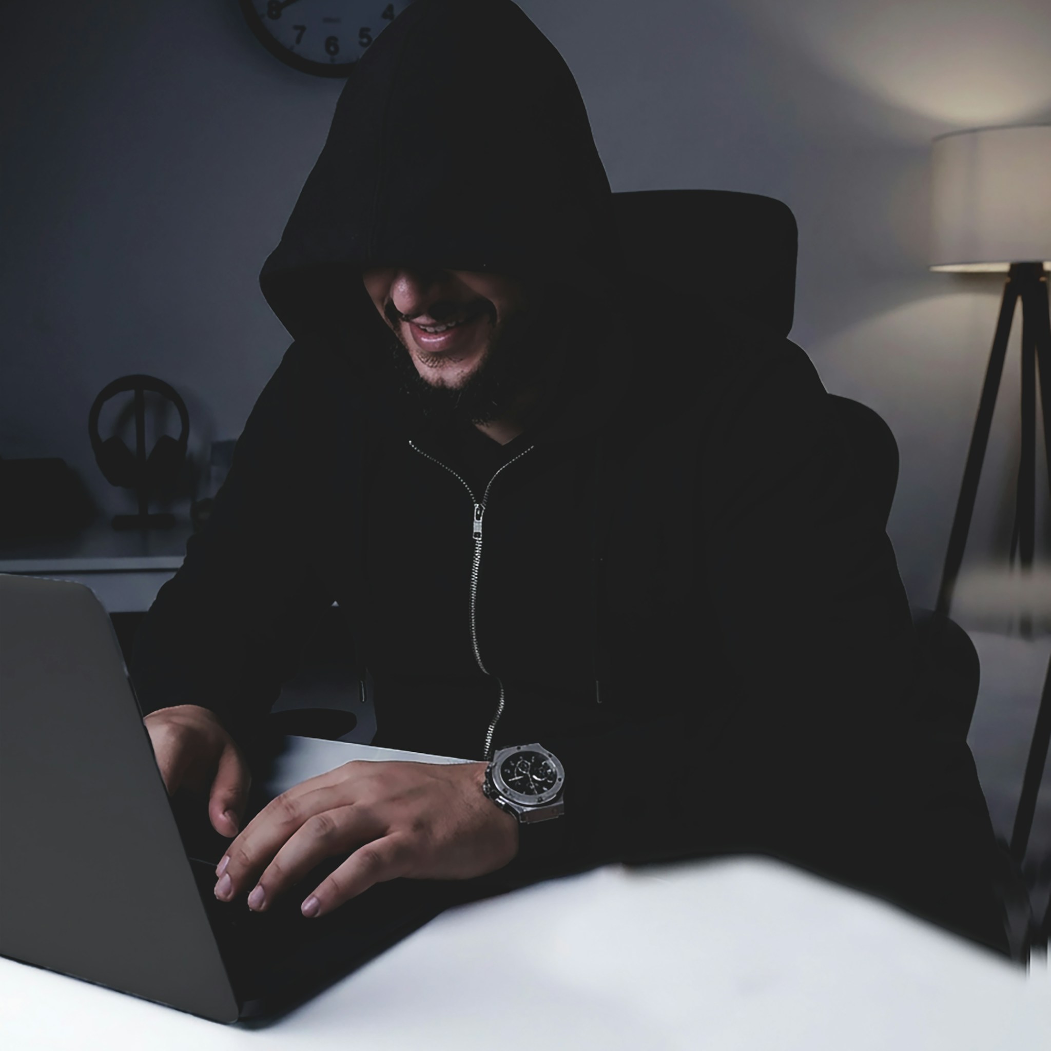 Developer focused on coding on a laptop, illustrating open-source work.