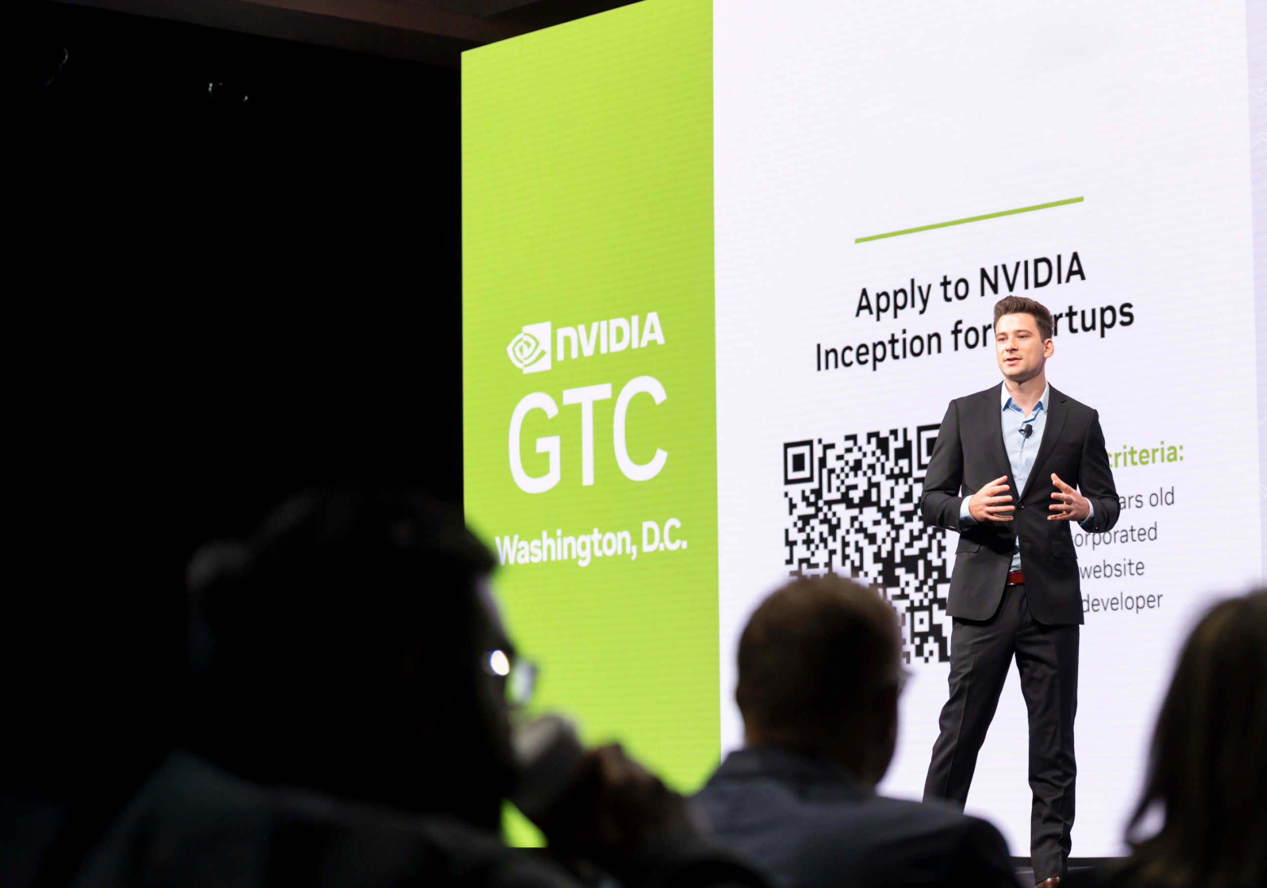 NVIDIA GTC conference stage with a large screen and audience, highlighting industry events.