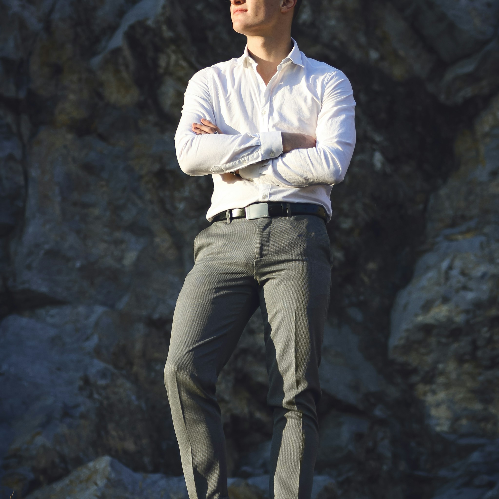A thoughtful man in a professional setting, symbolizing a researcher contemplating his beliefs.