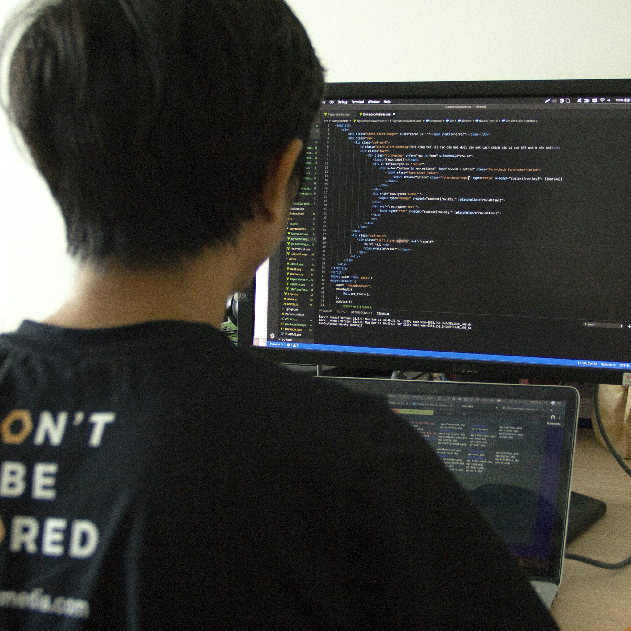An iOS developer focused on coding on a MacBook, representing Peter Steinberger's background.