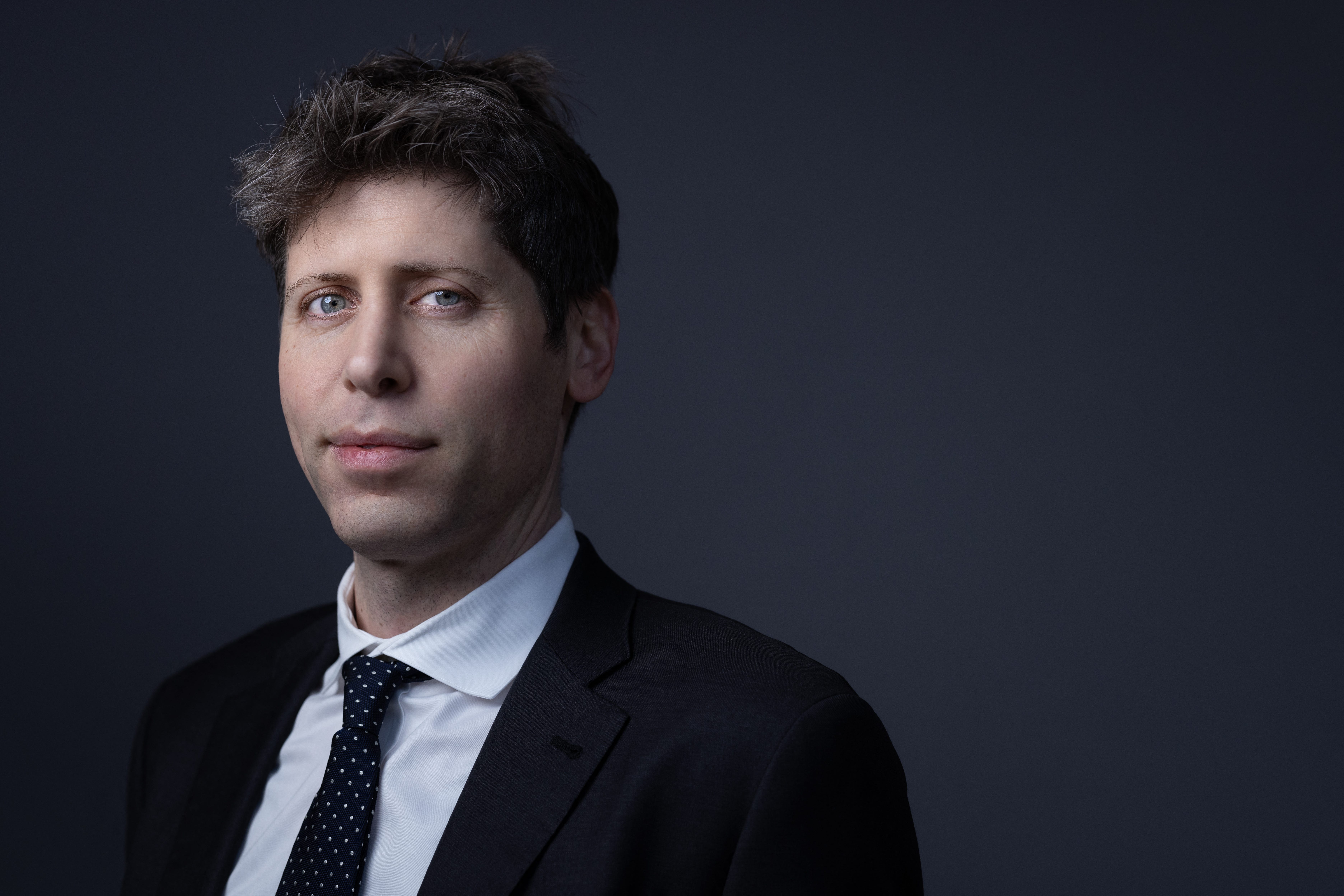 Portrait of Sam Altman, CEO of OpenAI, in a professional setting.