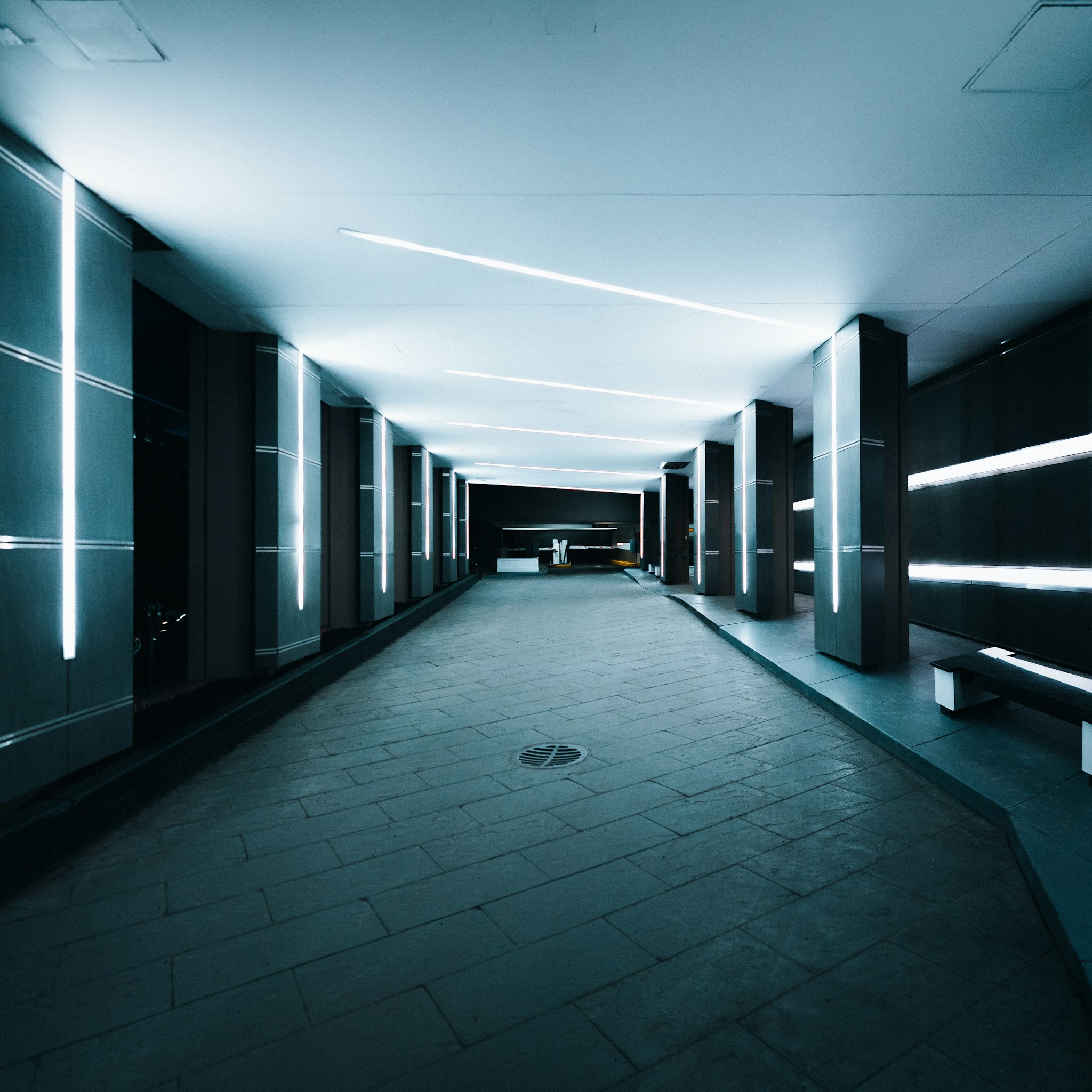 A massive aisle of illuminated server racks in a hyperscale data center representing the Colossus cluster.