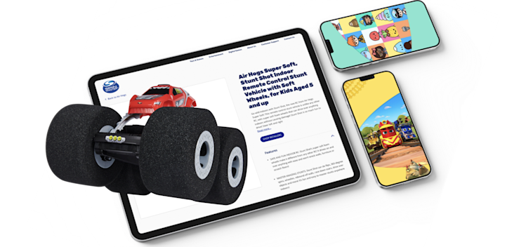 Spinmaster app displayed on a tablet and mobile screens.
