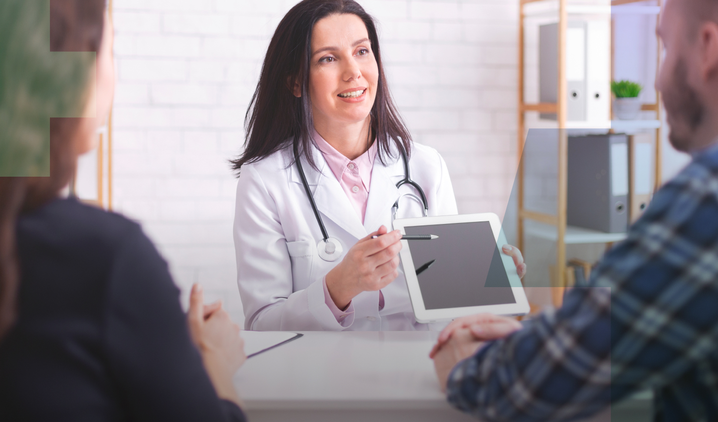 Doctor showing a patient the screen of a tablet.