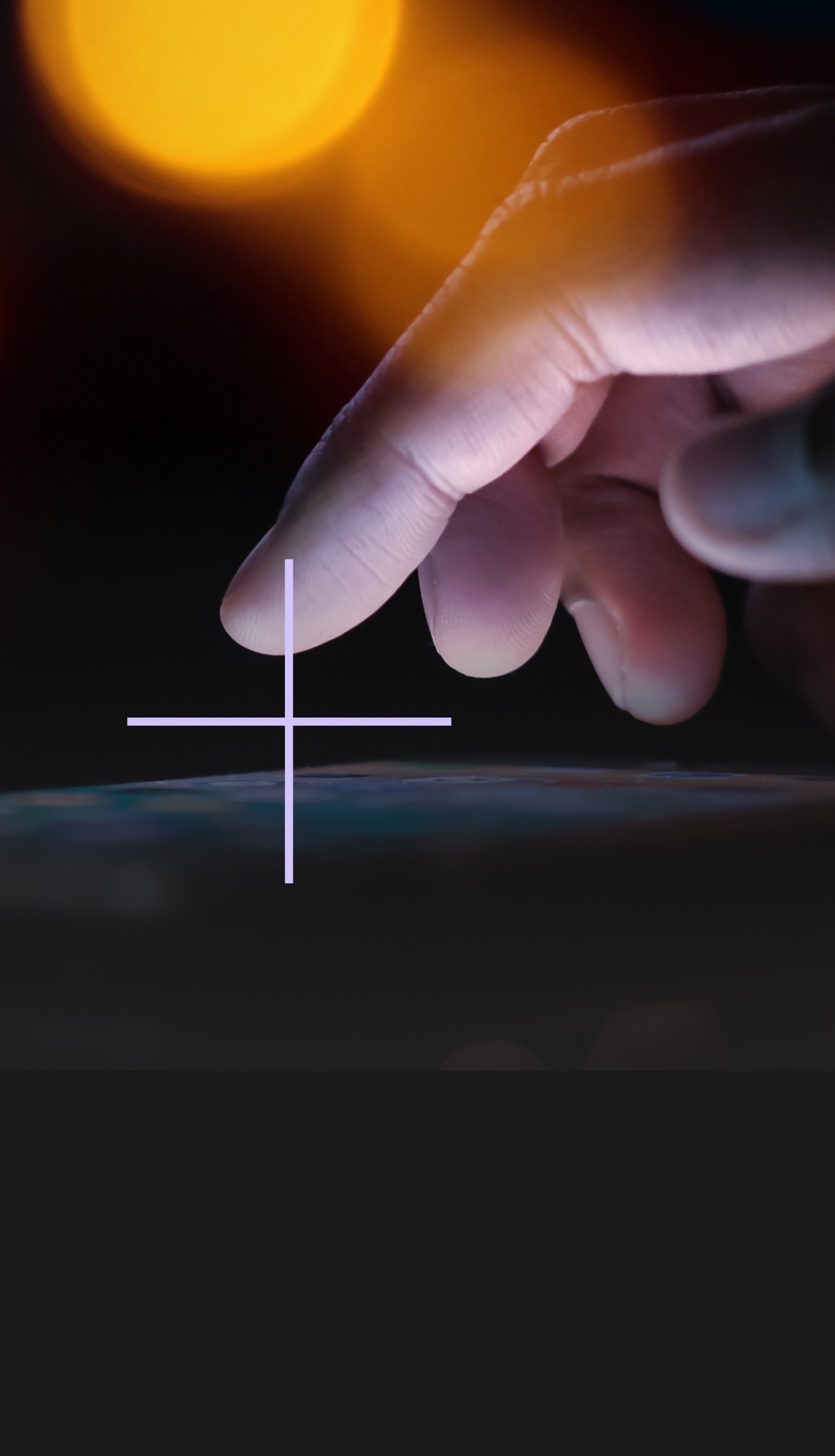 A hand tapping a digital tablet.