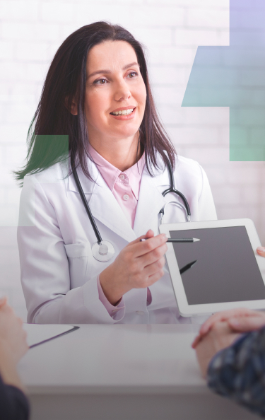 Doctor showing a patient the screen of a tablet.