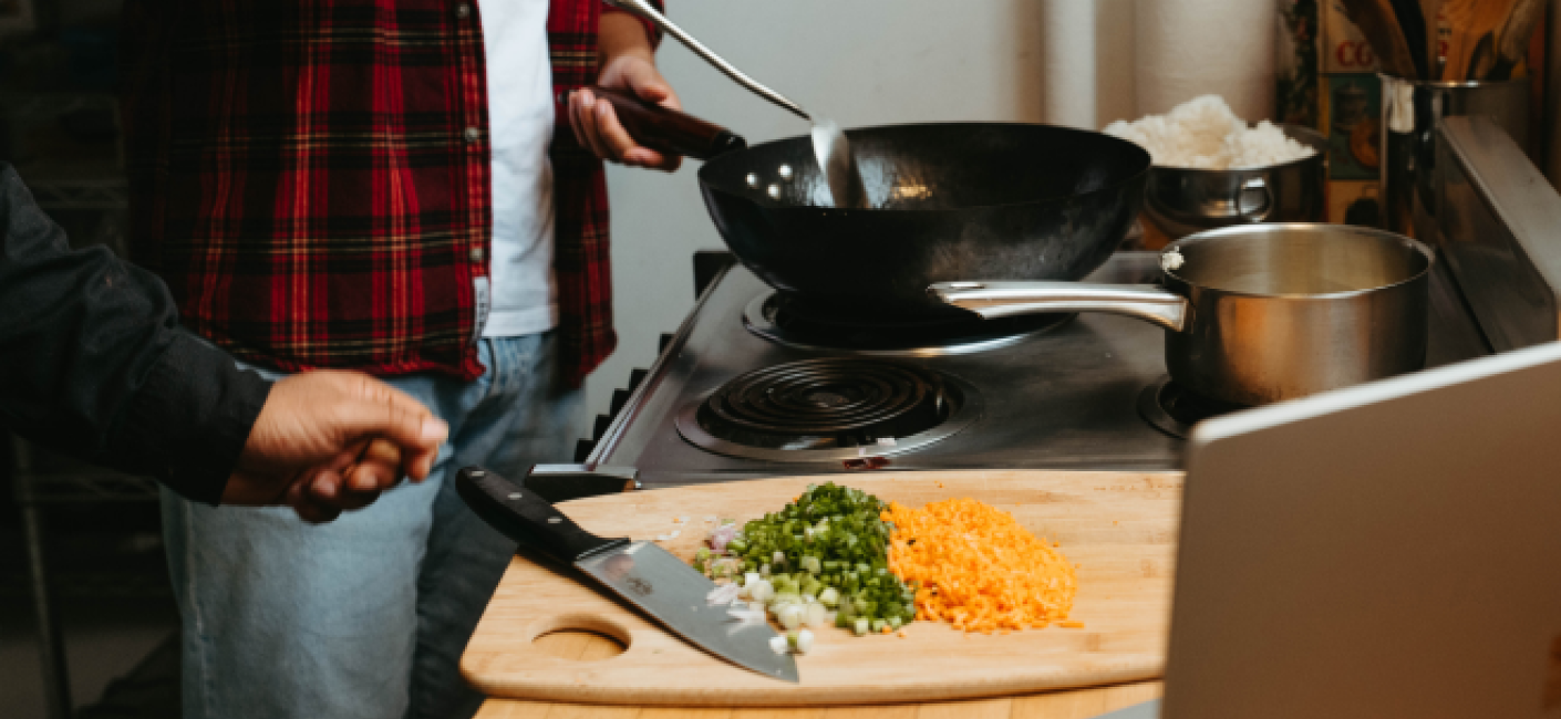 Couple cooking at home.