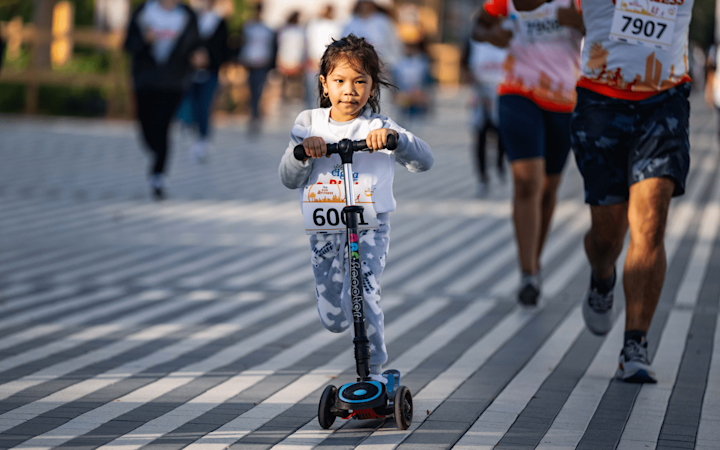 Cigna-Run-Little-Girl-On-Scooter