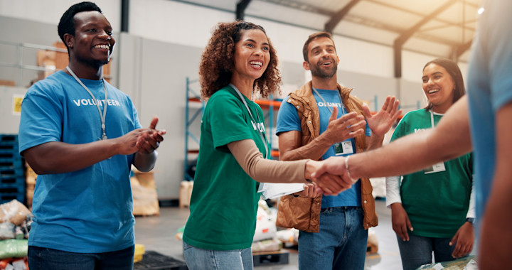 applause-handshake-and-support-with-volunteer-tea-2025-04-05-12-14-37-utc