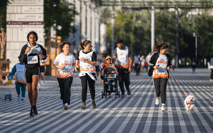 Cigna-Run-Group-Running-with-a-dog