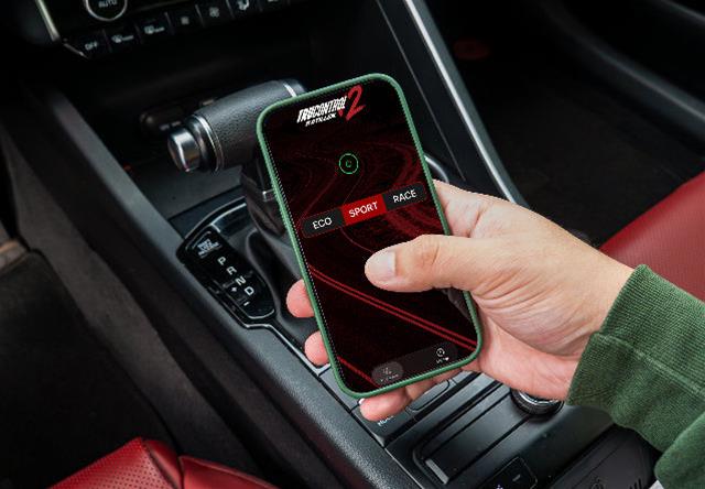 Image of person holding smart phone with app displayed on the screen