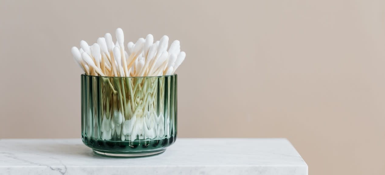 Cotton buds in a glass jar