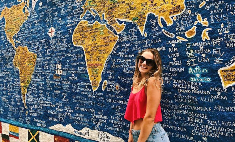 Picture of person in front of a map