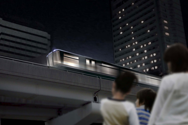 Rokko Liner run through night cityscape