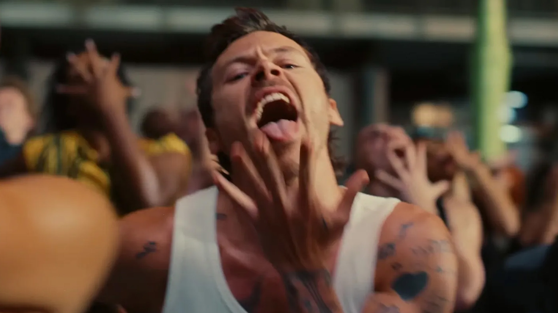 Harry Styles' shorts and microphone lick in 'Dance No More' video has me feral