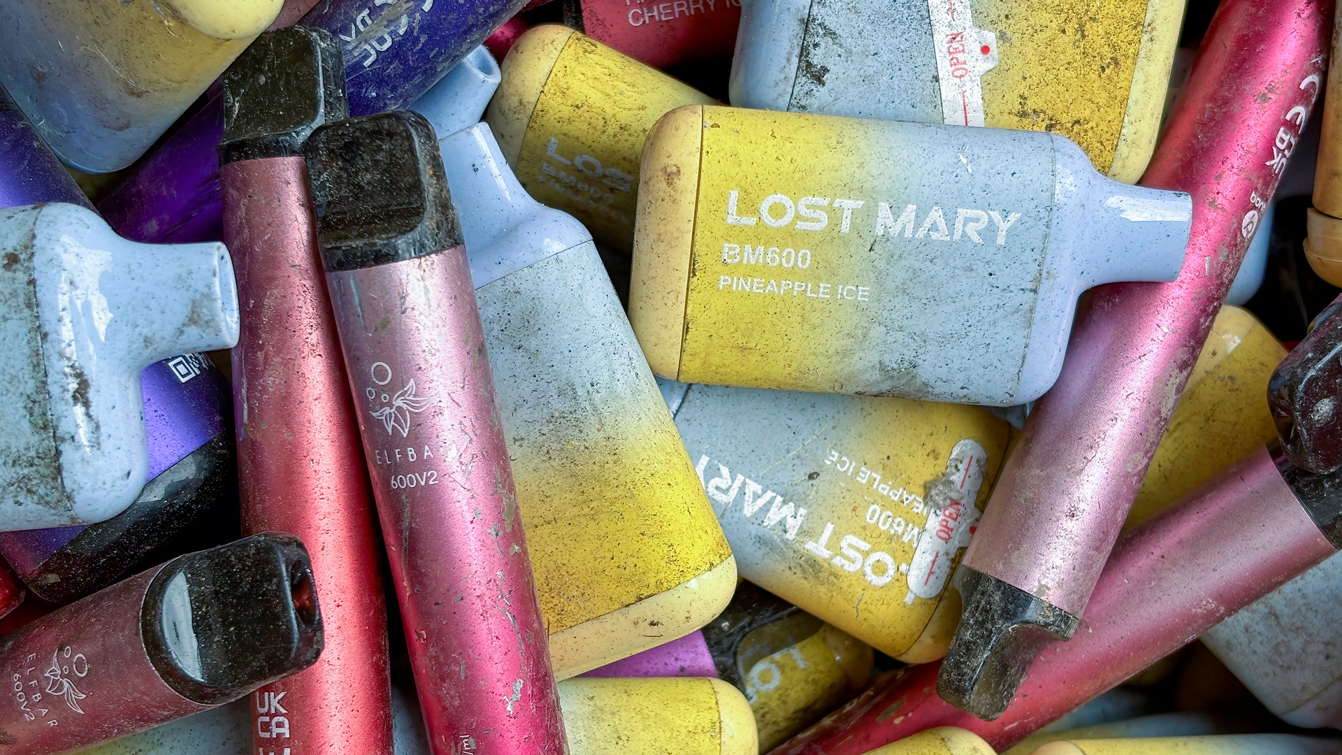 Colourful vape devices piled together