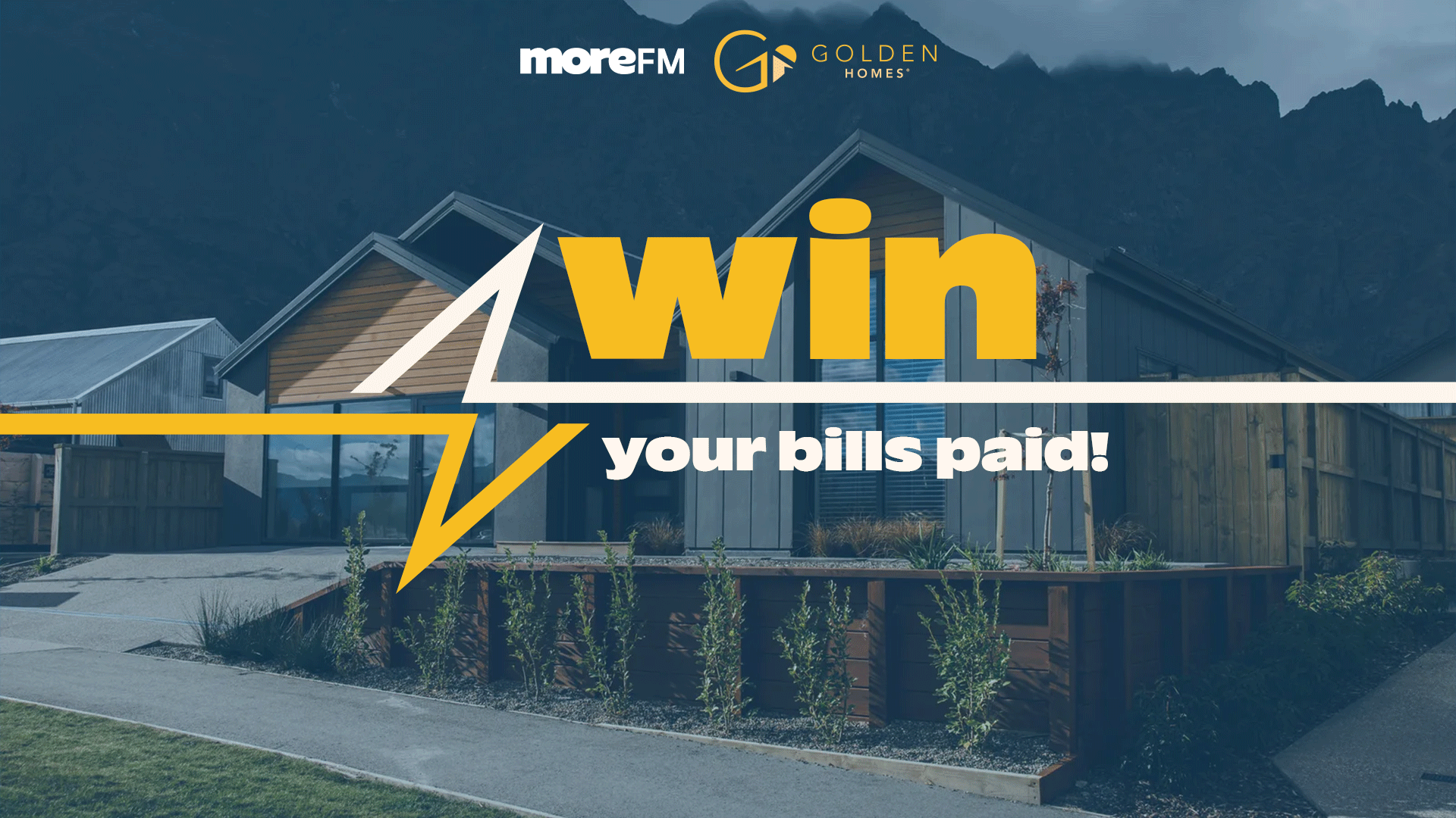 A modern house with a dark blue filter, overlaid with "WIN your bills paid!" in yellow, and logos for moreFM and GOLDEN HOMES®.