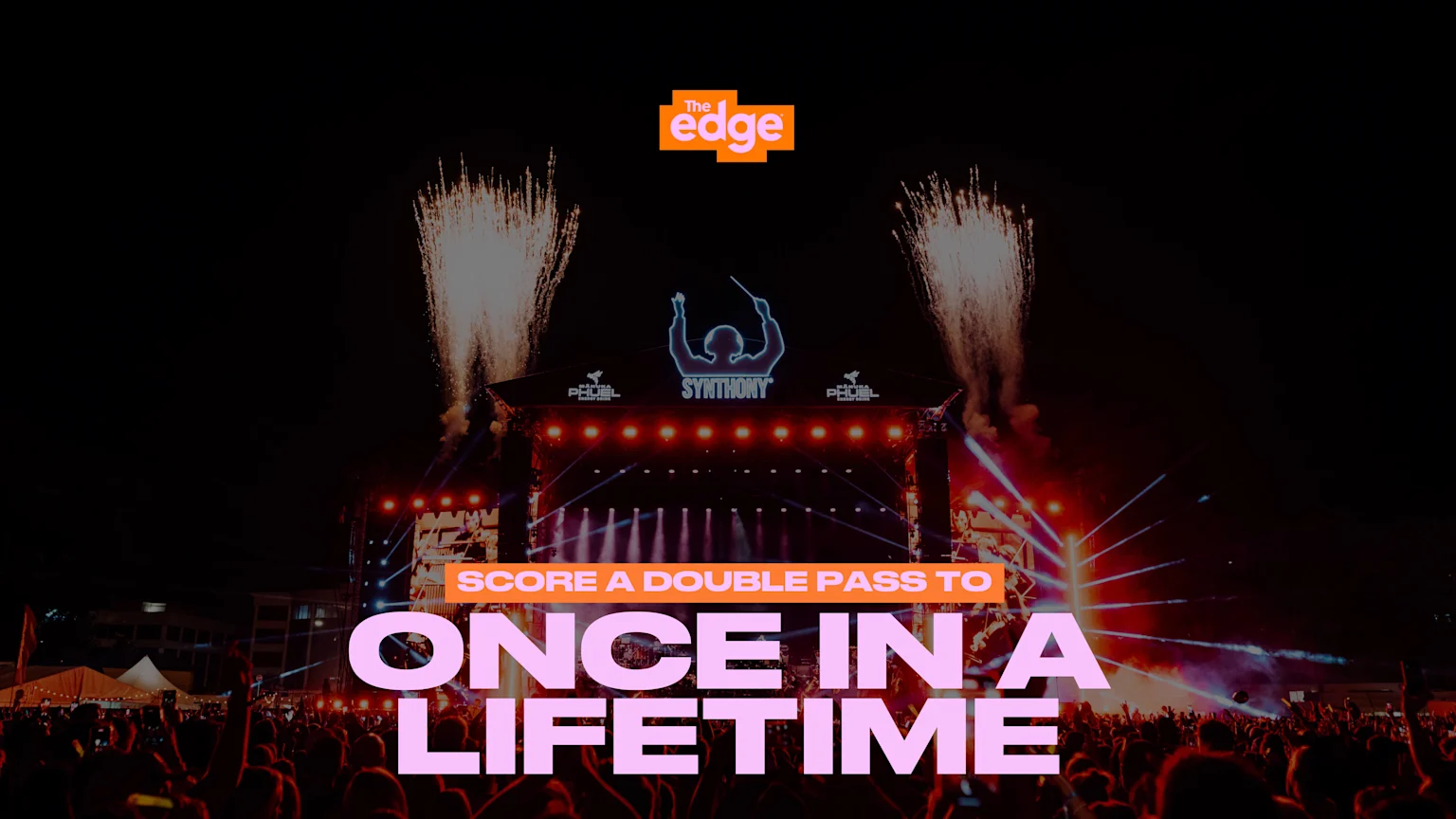 A dynamic outdoor concert at night with a large stage, bright lights, fireworks, and a crowd of people holding up their hands, overlaid with "The edge" logo and "SCORE A DOUBLE PASS TO ONCE IN A LIFETIME" text.