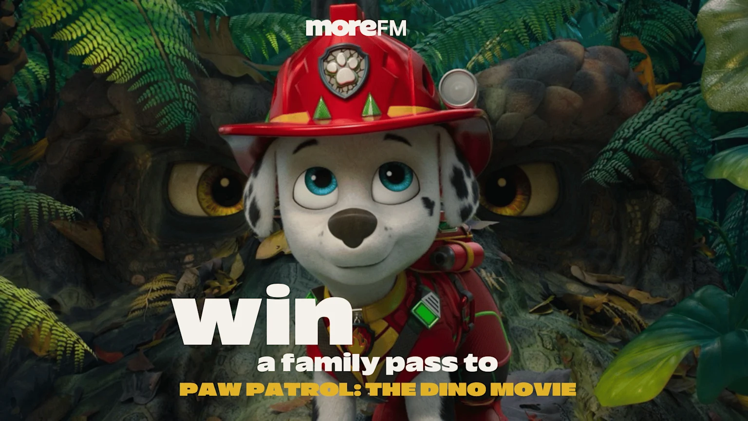 Marshall from Paw Patrol smiles in a jungle with large creature eyes in the background, promoting "moreFM" and a chance to "win a family pass to PAW PATROL: THE DINO MOVIE".