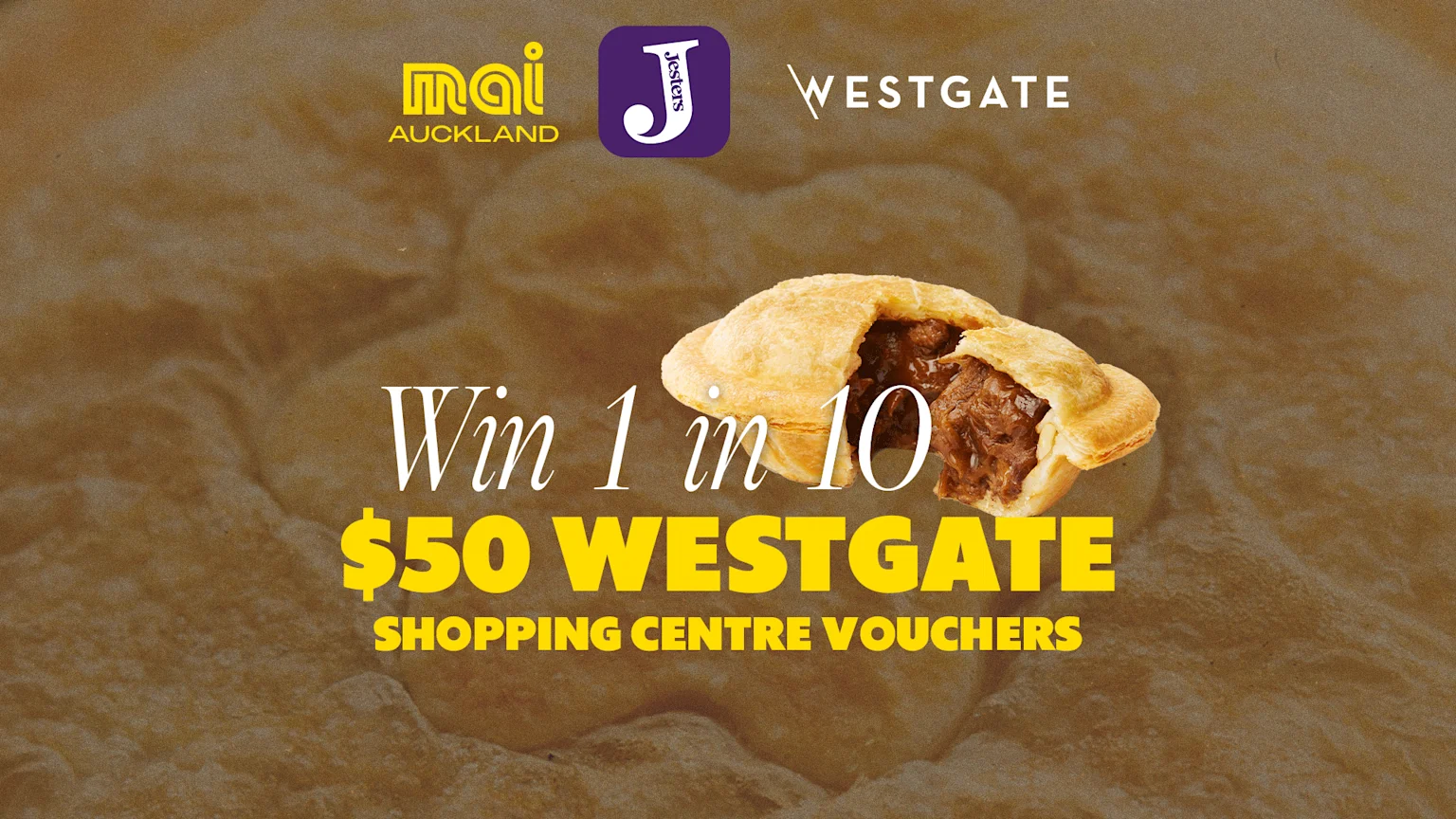 An advertisement on a golden-brown textured background featuring Mai Auckland, Jesters, and Westgate logos, with a pie and text: "Win 1 in 10 $50 WESTGATE SHOPPING CENTRE VOUCHERS".