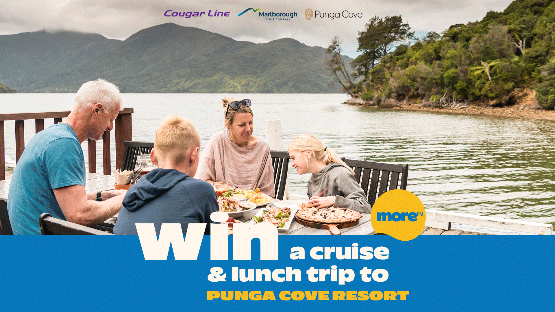 A family of four enjoys a meal on a deck overlooking a scenic bay with forested hills, with text promoting a "Win a cruise & lunch trip to Punga Cove Resort" competition.