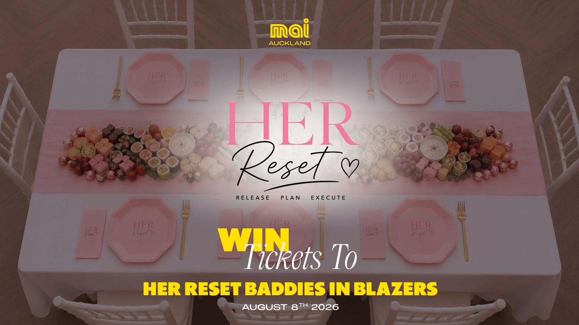 An overhead view of a dining table set with pink plates, rose gold forks, and a lavish spread of sweet and savory snacks, promoting 'HER Reset' and 'HER RESET BADDIES IN BLAZERS' event.