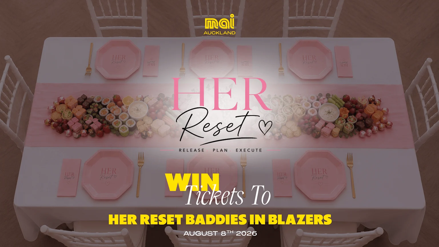 An overhead view of a dining table set with pink plates, rose gold forks, and a lavish spread of sweet and savory snacks, promoting 'HER Reset' and 'HER RESET BADDIES IN BLAZERS' event.