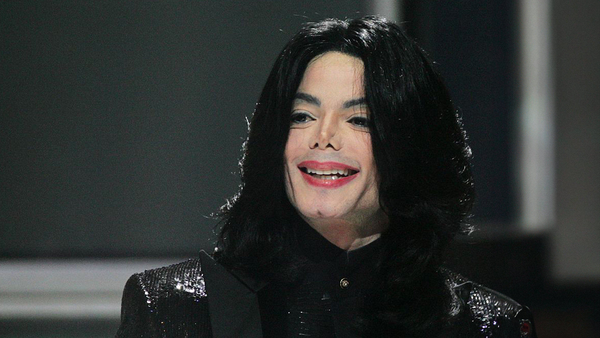 Michael Jackson stands on stage, circa 2006