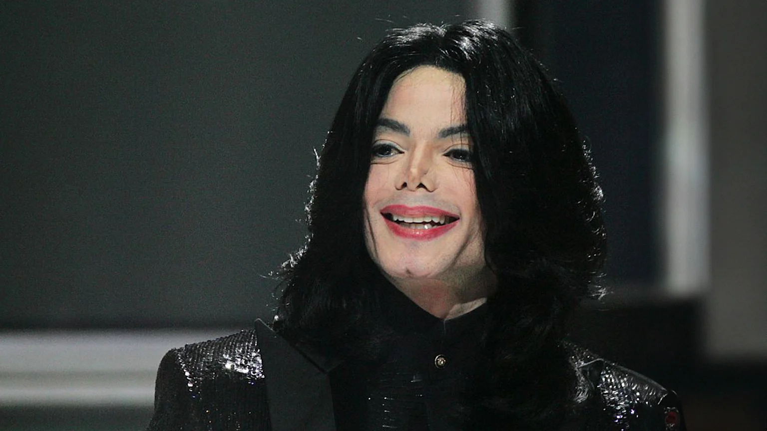 Michael Jackson stands on stage, circa 2006