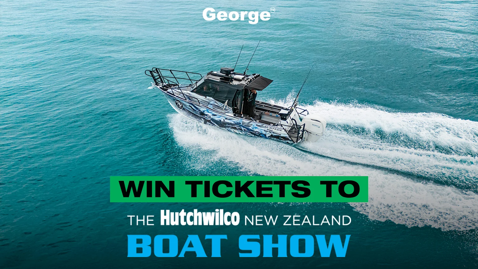A powerboat with a blue and white camouflage design speeds across teal water, creating a white wake, with text overlay for "George" and "WIN TICKETS TO THE Hutchwilco NEW ZEALAND BOAT SHOW".