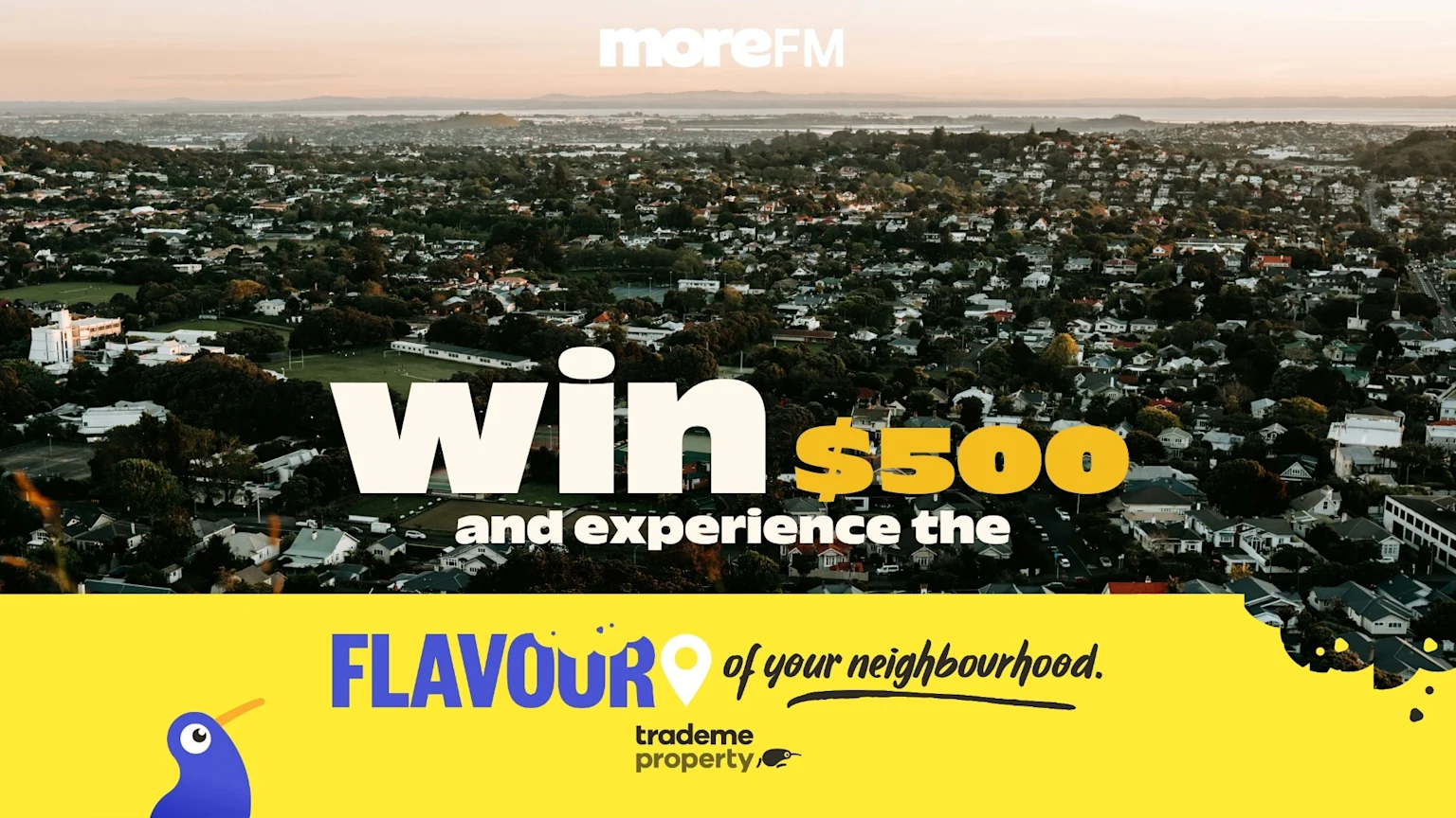 Aerial view of a suburban neighborhood with "Win $500 and experience the FLAVOUR of your neighbourhood." text overlays, promoting a contest from moreFM and trademe property.
