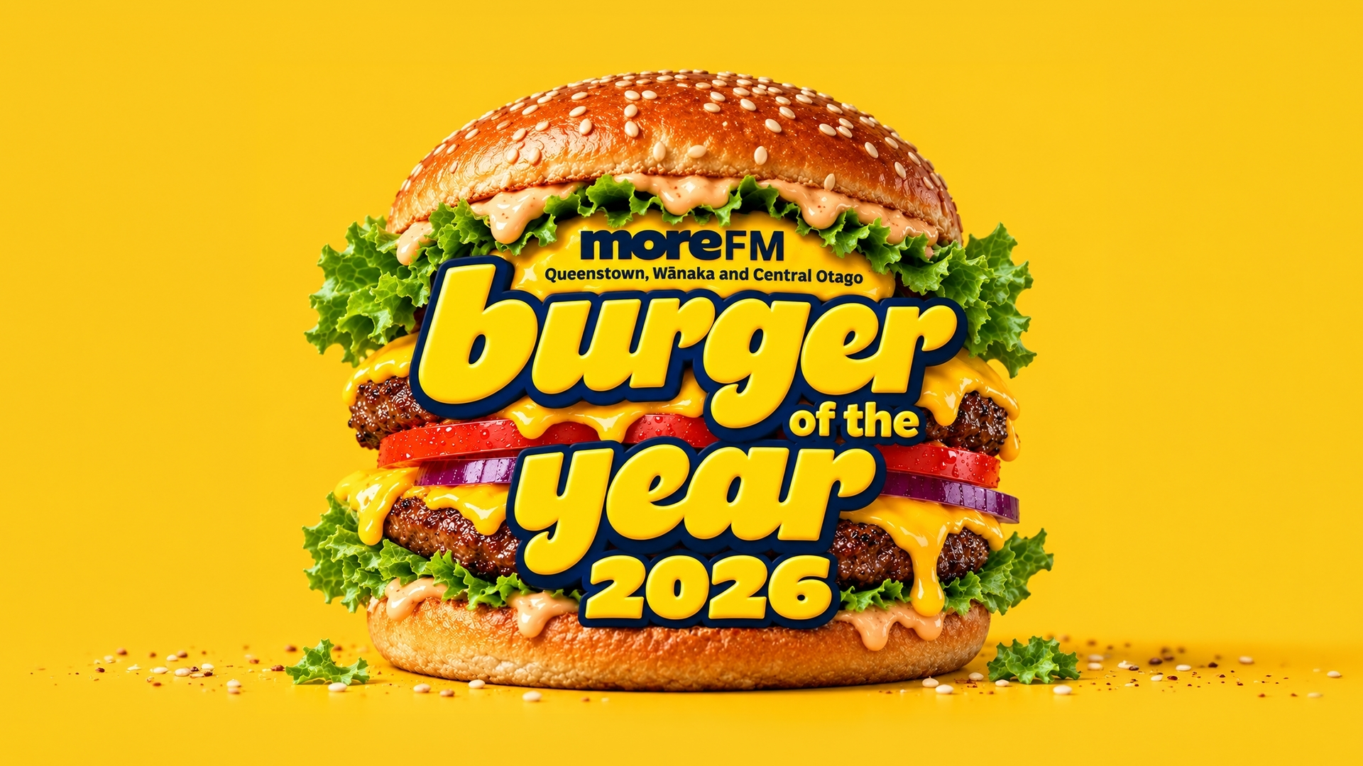 A delicious burger on a yellow background with bold "moreFM Burger of the Year 2026" text, featuring two patties, cheese, lettuce, tomato, onion, and sauce.