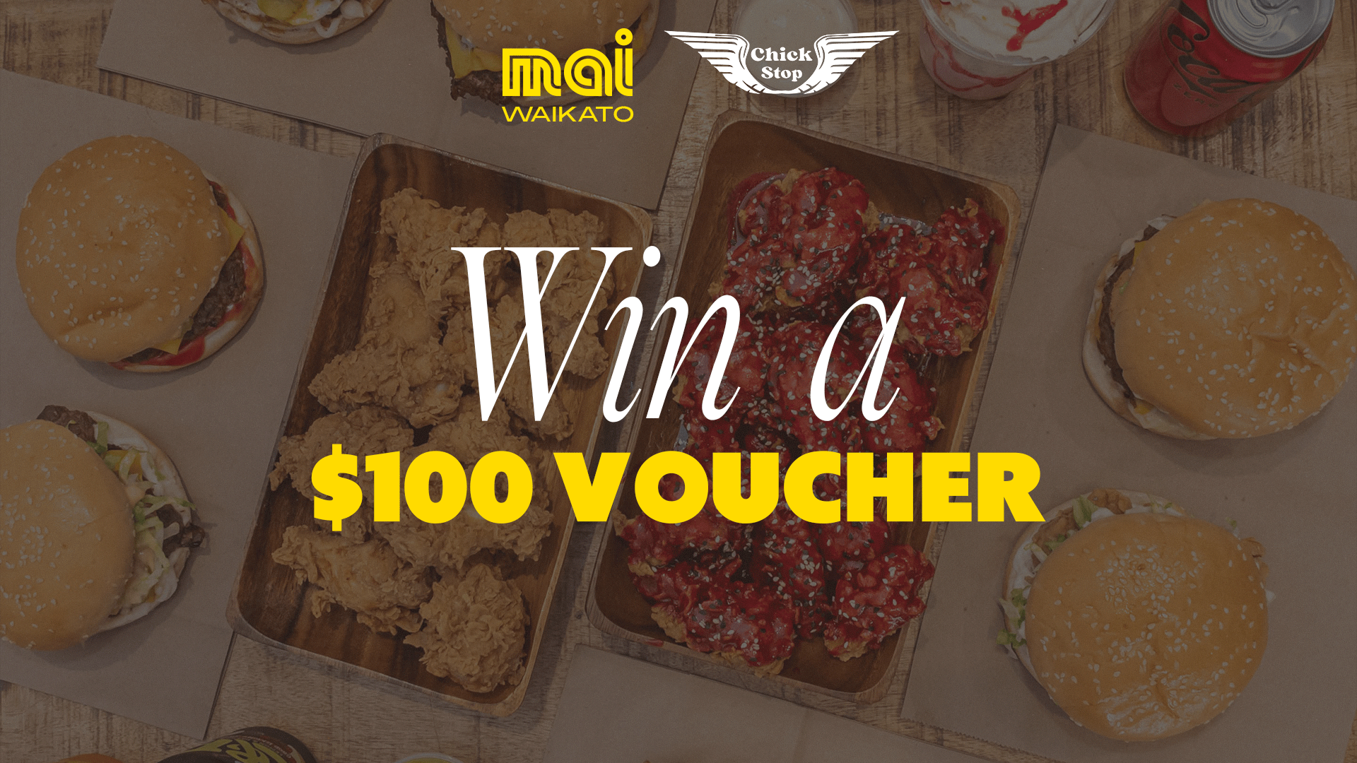 A flat lay shows a spread of fried chicken, spicy wings, burgers, a milkshake, and a soda, featuring 'Mai Waikato' and 'Chick Stop' logos, with 'Win a $100 VOUCHER' overlaid.