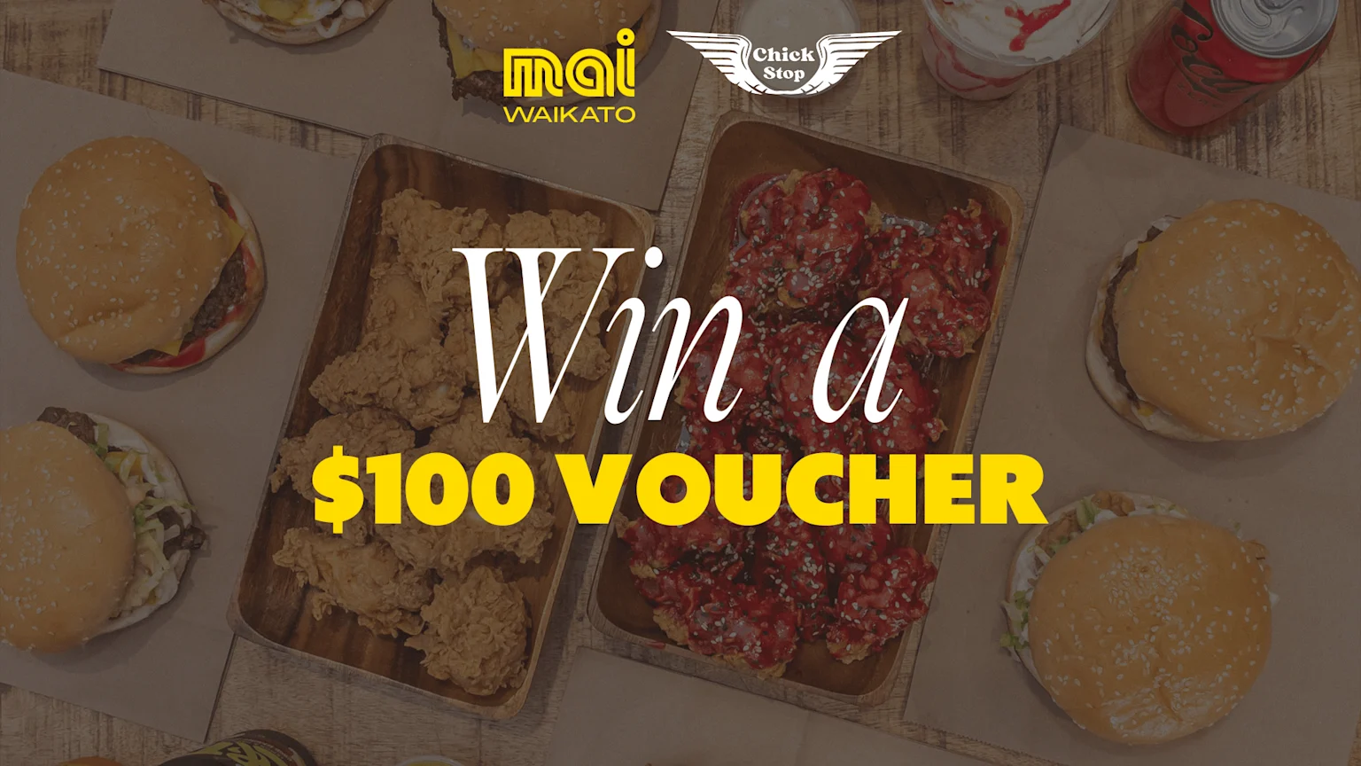 A flat lay shows a spread of fried chicken, spicy wings, burgers, a milkshake, and a soda, featuring 'Mai Waikato' and 'Chick Stop' logos, with 'Win a $100 VOUCHER' overlaid.