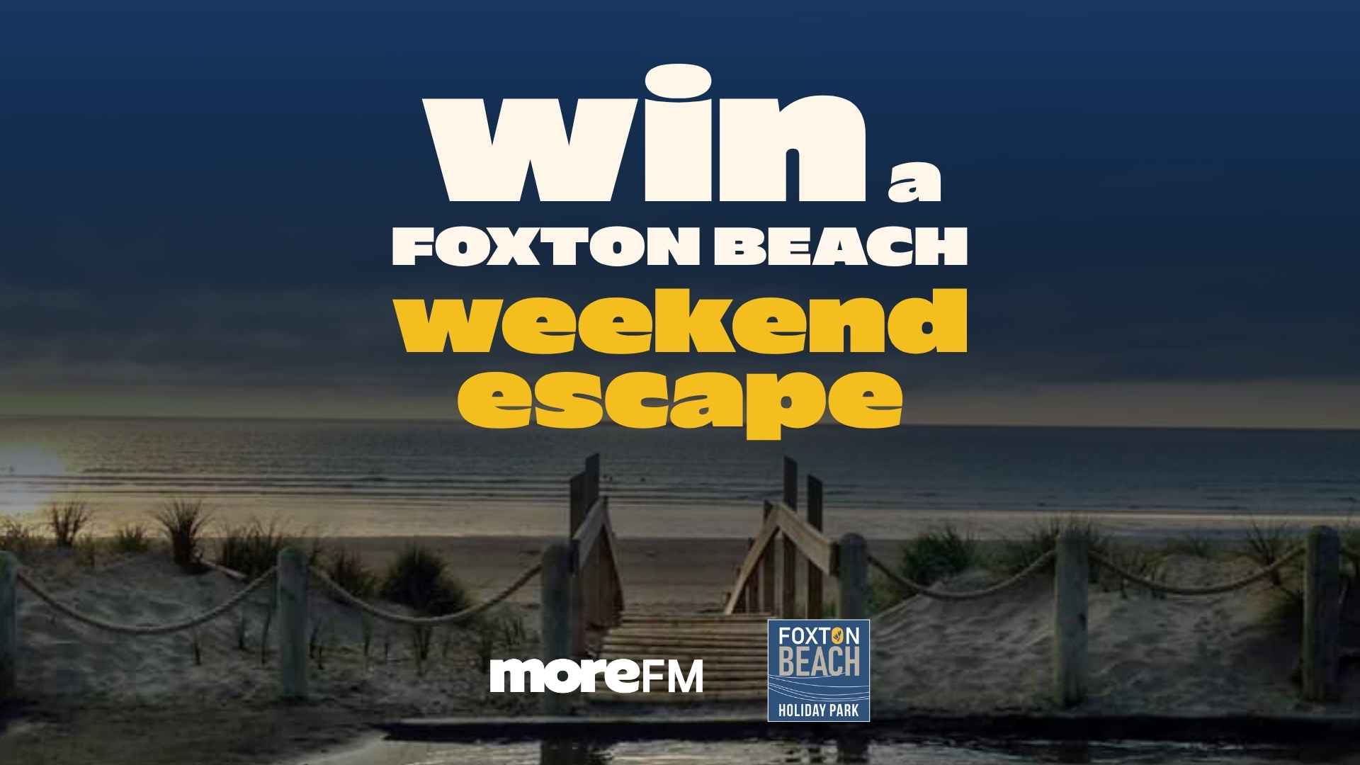 Text reads 'Win a Foxton Beach weekend escape' over a sunset beach scene with a boardwalk, sand dunes, and the ocean, along with 'moreFM' and 'FOXTON BEACH HOLIDAY PARK' logos.