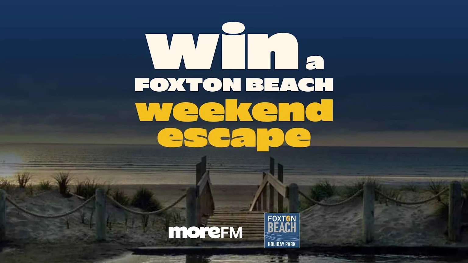 Text reads 'Win a Foxton Beach weekend escape' over a sunset beach scene with a boardwalk, sand dunes, and the ocean, along with 'moreFM' and 'FOXTON BEACH HOLIDAY PARK' logos.