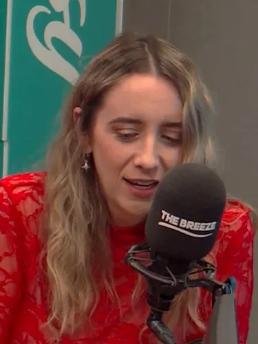 Country star Kaylee Bell talking in the breeze studio