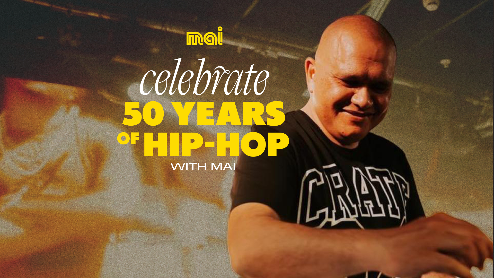 DJ Sir-Vere on stage playing, "Celebrate 50 years of Hip-Hop with Mai" 