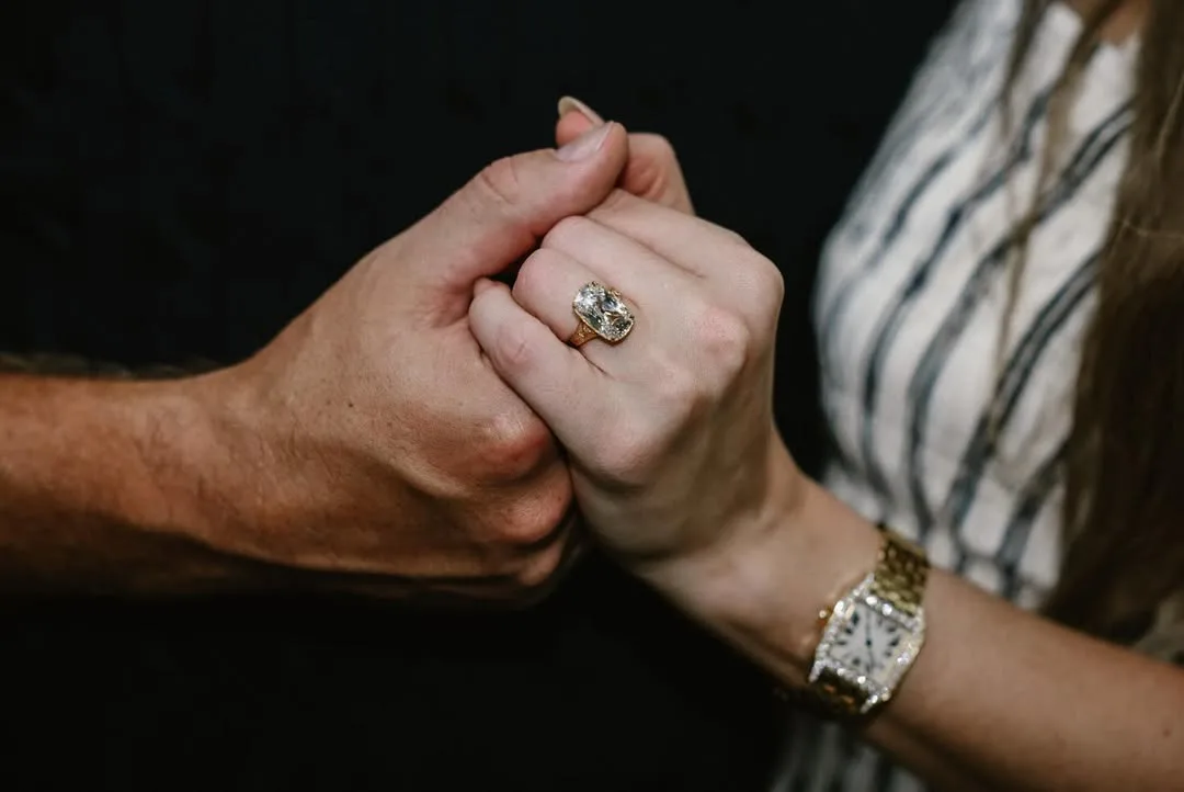 Taylor and Travis hands with diamon ring on