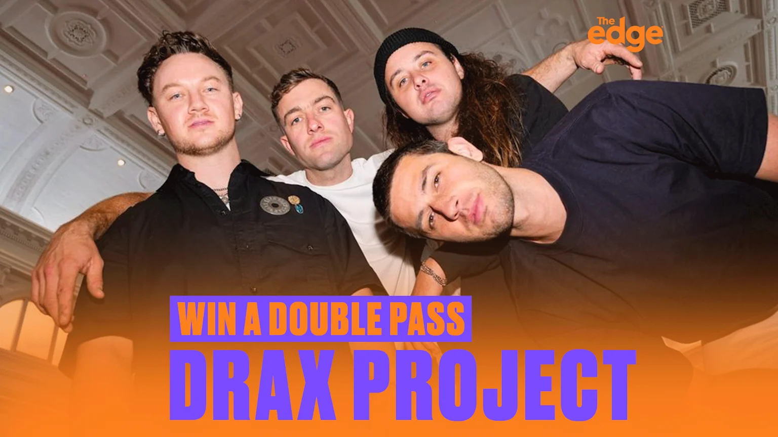 Four men, the band Drax Project, pose in front of a decorative ceiling, with "WIN A DOUBLE PASS DRAX PROJECT" text and "The edge" logo on an orange overlay.